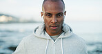 Fitness, black man and portrait on beach for exercise, wellness and endurance training. Athlete, runner and challenge at ocean with workout, physical health and resilience at California seaside