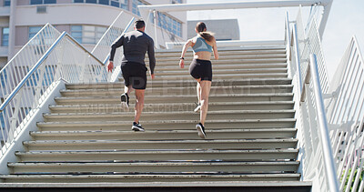 Buy stock photo Running, fitness and stairs with couple in city for personal trainer, health and team. Wellness, race and marathon training with back of people outdoor steps for workout, exercise or sports low angle