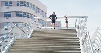 Buy stock photo Fitness, break and stairs with couple in city for personal trainer, runner and teamwork. Tired, race and marathon training with people outdoors steps for workout, exercise and fatigue together