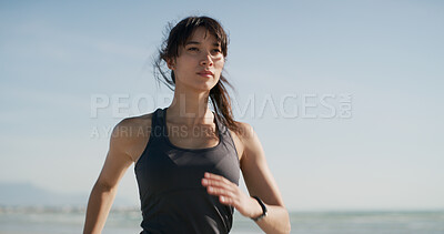 Buy stock photo Fitness, woman and running on beach for exercise, wellness and endurance training. Athlete, marathon and challenge at ocean with active workout, physical health and space at California seaside