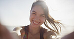 Fitness selfie, girl and happy at beach for exercise vlog, social media post or online workout update. Athlete, person and smile with photography by ocean for training live streaming and lens flare