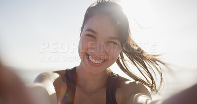 Buy stock photo Fitness selfie, girl and happy at beach for exercise vlog, social media post or online workout update. Athlete, person and smile with photography by ocean for training live streaming and lens flare