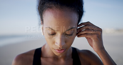Buy stock photo Fitness, woman and music on beach for exercise, sweat and training podcast for thinking. Tired athlete, marathon and earphones at ocean with workout, health and resilience at California seaside