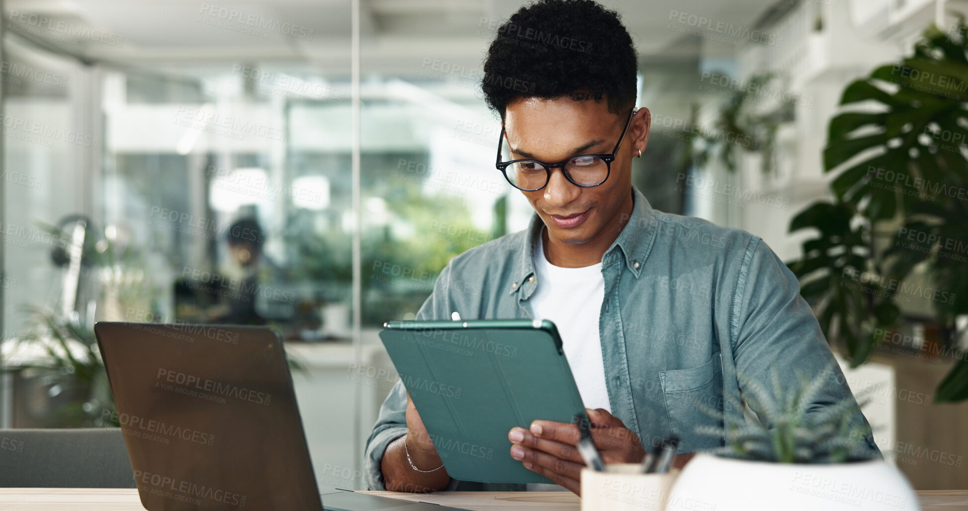 Buy stock photo Business man, tablet and reading at startup in office for insight, thinking or project management. Person, checklist and digital touchscreen for review, app and feedback with smile at creative agency