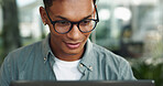 Reading, laptop and glasses with business man in office for journalist, article proofreading and editor. Email, news and report with employee in startup agency for entrepreneur, network and project