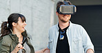 Couple, vr and headset in city with game, laughing and guide for rpg with futuristic tech in street. Woman, man and happy with augmented reality, glasses and playful with metaverse on road in Spain