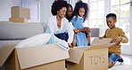 Happy, black family and unboxing toys with kids for moving in new home together or relocation. African, mom and dad with excited children for unpacking, property or package in living room at house