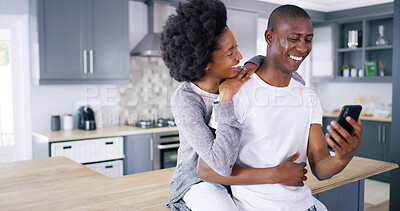 Buy stock photo Black couple, phone and laugh in kitchen with social media, meme scroll and funny video on internet. Happy man, woman and mobile in home for relax, good news and hug on counter with streaming comedy
