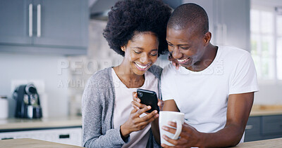 Buy stock photo Black couple, mobile and coffee in kitchen with social media, ecommerce and funny video on internet. Happy woman, man and phone in home with tea, good news and relax at counter on streaming platform