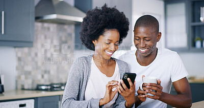 Buy stock photo Black couple, mobile and coffee in kitchen with ecommerce, social media and funny video on internet. Happy woman, man and phone in home with tea, good news and relax at counter on streaming platform