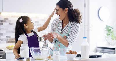 Buy stock photo Playful, mom and girl with kitchen, baking and learning with ingredients for dessert cake and bonding. Smile, happy mother and teaching cooking daughter for support, cookies or recipe prepare in home