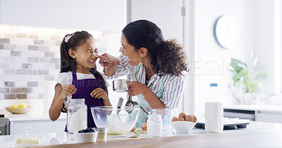 Buy stock photo Playful, mom and child with kitchen, baking and learning with ingredients for pastry or dessert cake. Smile, happy mother and teaching cooking daughter for pudding, cookies or recipe prepare in home