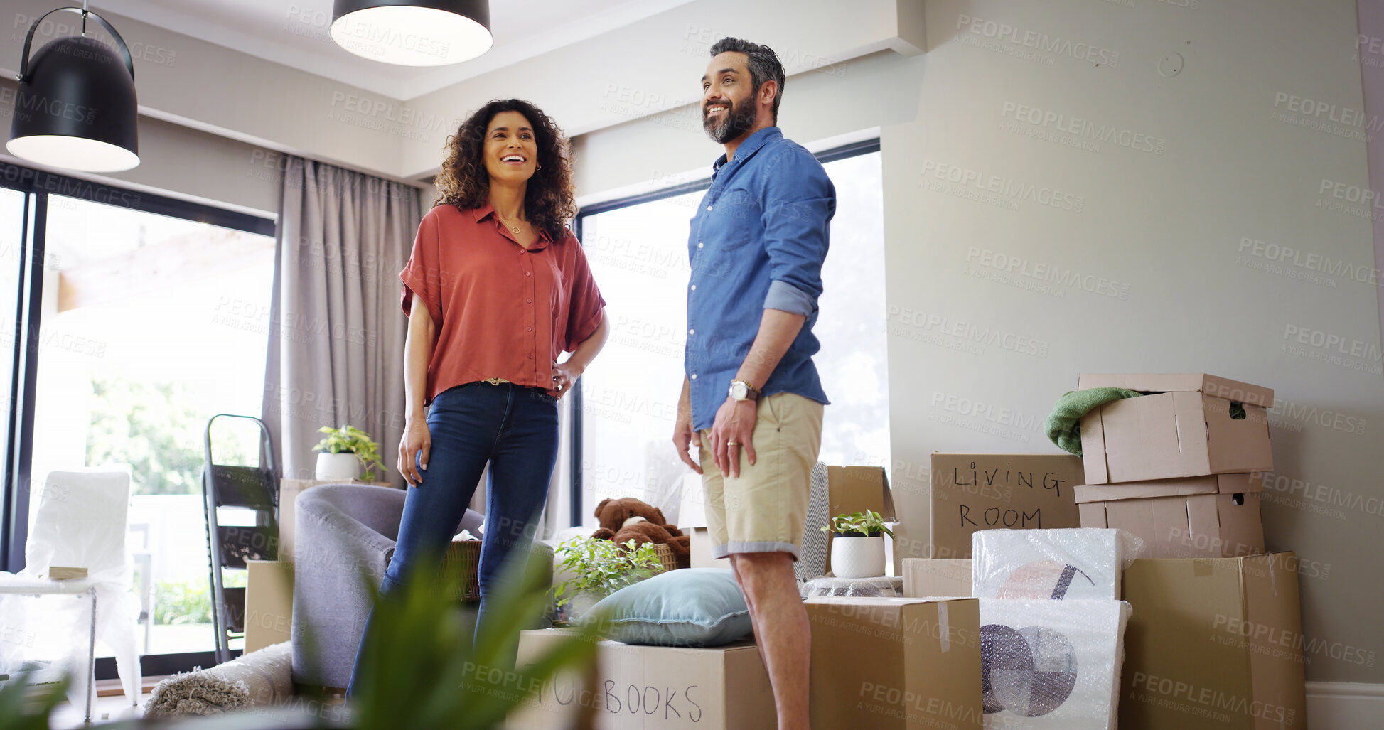 Buy stock photo Couple, rent and excited for moving in new home, relocation success and homeowners for mortgage. People, wow and proud of real estate achievement in living room, support and buy for house security
