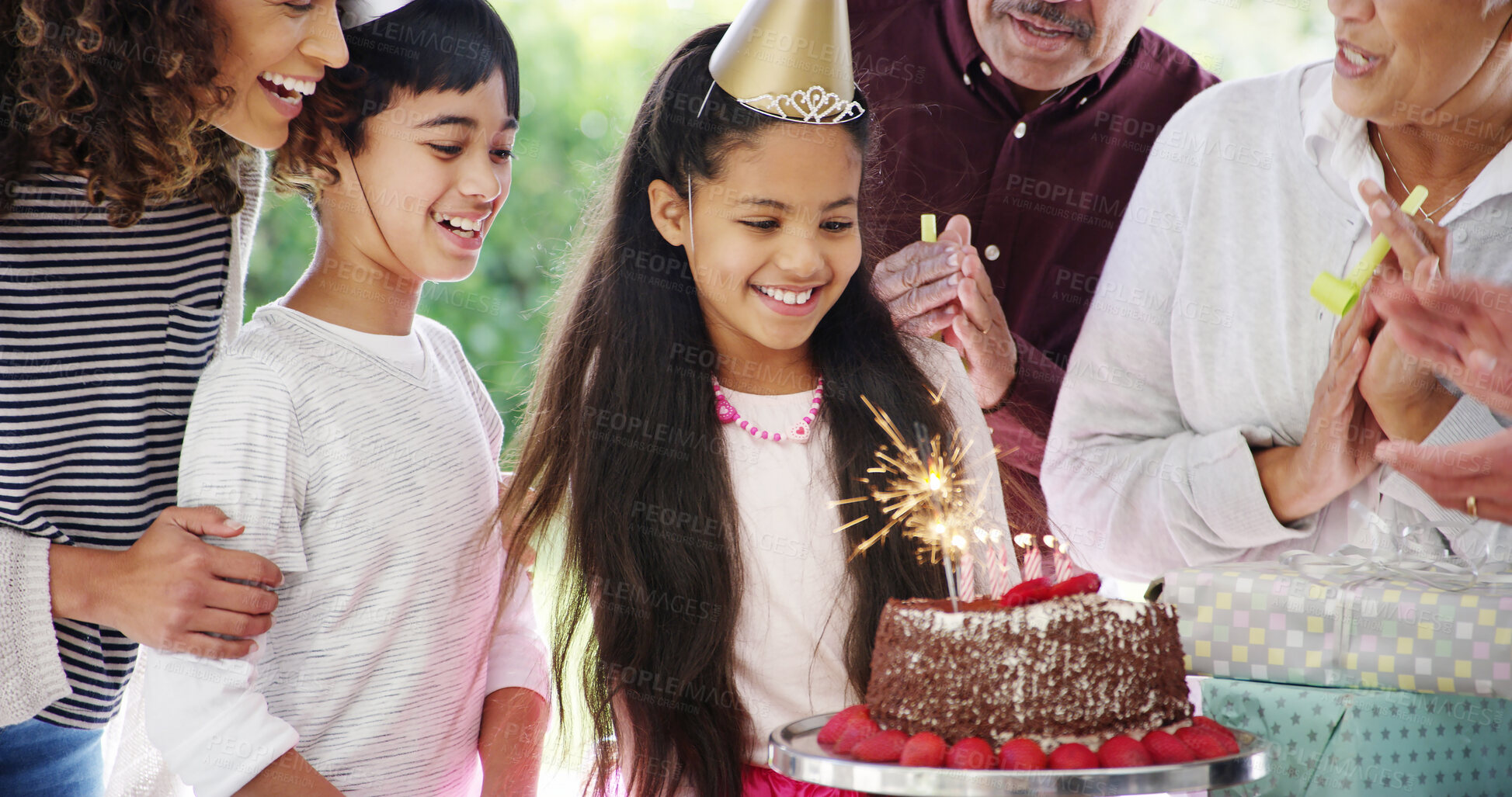 Buy stock photo Birthday cake, big family and happy girl with celebration, parents and party with singing and clapping. Generations, child and daughter with chocolate dessert, special day and bonding at home