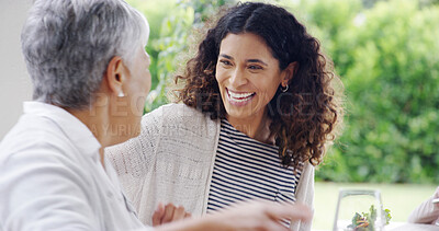 Buy stock photo Family, dinner or women with laughing outdoor for funny joke, festive celebration or social gathering. Thanksgiving, happy people or conversation together on patio with love, holiday lunch or bonding
