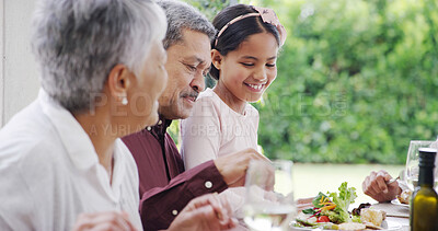 Buy stock photo Food, grandparents and grandchild at dinner by home for eating, festive celebration and social gathering. Happy family, people and bonding together on patio with love, holiday lunch or thanksgiving
