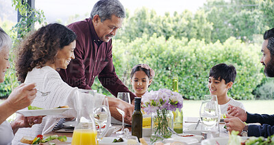 Buy stock photo Dinner, family and eating with food outdoor for bonding, festive celebration and social gathering. Thanksgiving, people and healthy meal together on patio with love, holiday event and hosting by home