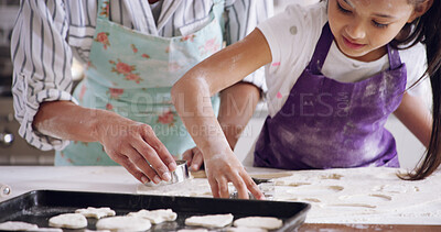 Buy stock photo Mom, daughter and cookie cutter in home, baking together and pastry education for development. Mother, girl and helping parent press shape in dough, kitchen learning and support with dessert biscuits