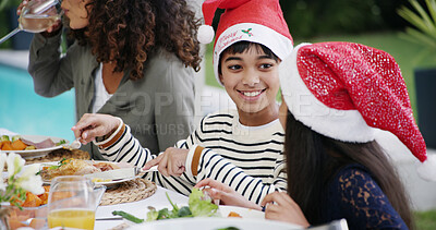 Buy stock photo Christmas, children and eating lunch by home for festive celebration, bonding or conversation outdoor. Food, family or happy people on patio for holiday dinner, social gathering or fun with santa hat