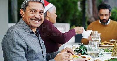 Buy stock photo Christmas, senior man and family in home for meal, festive celebration and tradition. Happy grandpa, portrait and people on patio for lunch party, community and relax at reunion or social gathering