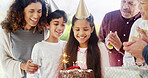 Birthday cake, family and children with parents for celebration, party and excited for future growth. Happy generations, kid and daughter with chocolate dessert, special day and bonding at home