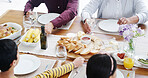Family, hands and table with food for lunch, meal or thanks giving dinner together at home. Children, parents and hungry people bonding with platter of bread for holiday feast, eating or dining