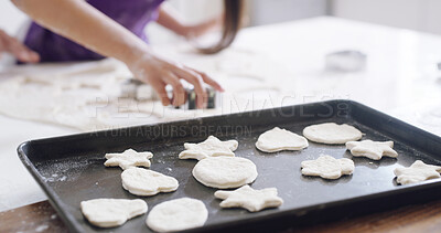 Buy stock photo Christmas, cookies and baking with hands in kitchen for helping, food and festive dessert. Xmas holiday, snack and recipe with closeup of tray with people in family home for baker, flour and teaching