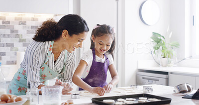 Buy stock photo Help, mom and child with cookies, baking and learning with ingredients for kitchen dessert and bonding. Smile, happy mother and teaching daughter for support, sweets or bakery recipe prepare in home