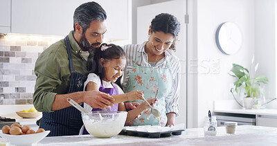 Buy stock photo Parents, child or happy in kitchen for baking, teaching recipe or love with activity. Family, young girl or making muffins in home for relationship development, weekend fun or bonding with mom or dad