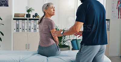 Buy stock photo Advice, physiotherapy and consulting with old woman in clinic for healthcare, osteoarthritis or symptoms. Medical, physical therapy and helping with senior patient for chiropractor and rehabilitation