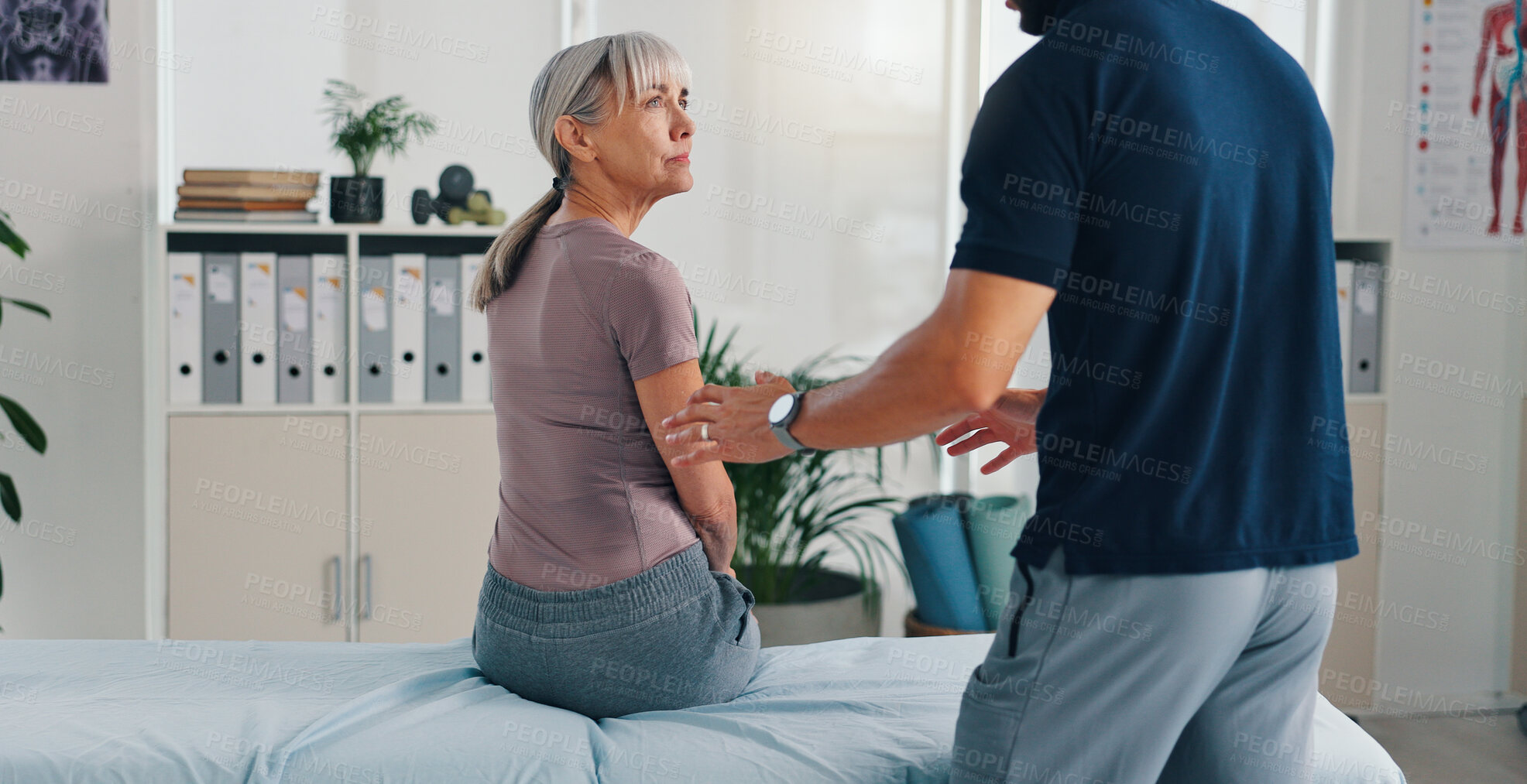 Buy stock photo Advice, physiotherapy and consulting with old woman in clinic for healthcare, osteoarthritis or symptoms. Medical, physical therapy and helping with senior patient for chiropractor and rehabilitation