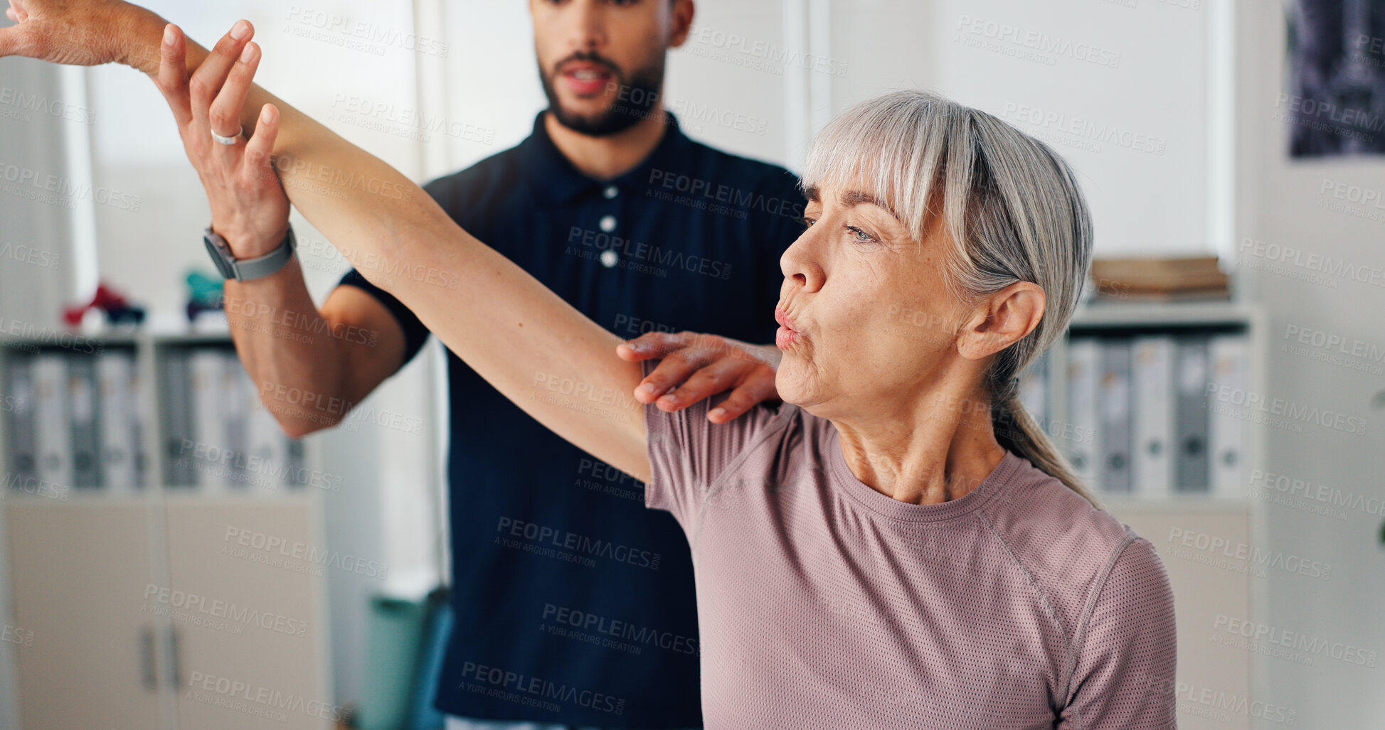 Buy stock photo Stretch arm, physical therapy and senior woman or patient at consultation for problem, inflammation or arthritis. Person, chiropractor and exercise for pain, rehabilitation and recovery of muscle