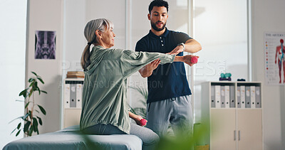 Buy stock photo Physiotherapist, arm or senior woman with dumbbells for rehabilitation, muscle exercise or body health. Shoulder mobility, physiotherapy or client with light weights for physical recovery or balance