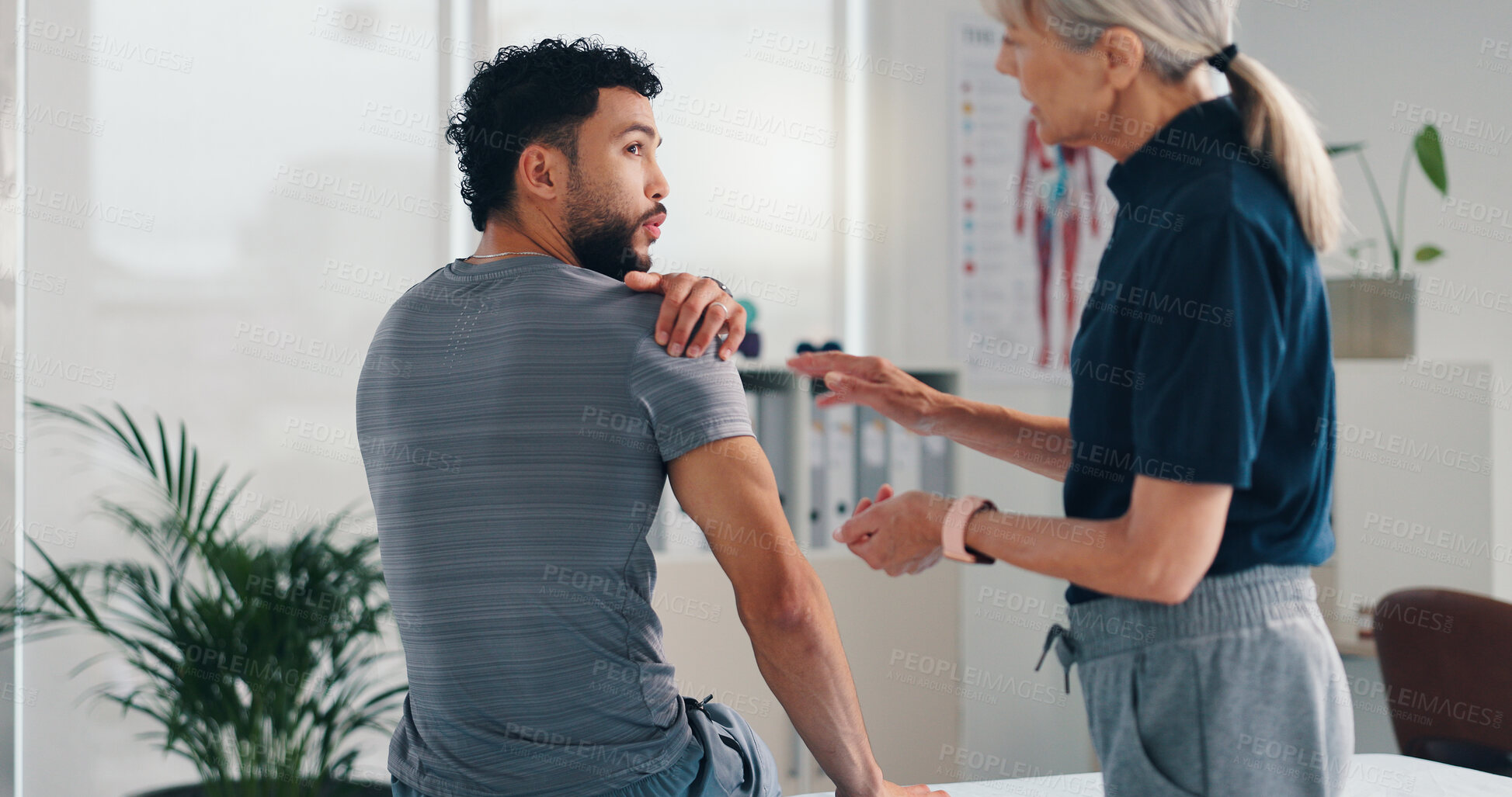 Buy stock photo Physical therapy, shoulder pain and patient man at consultation for problem or inflammation. Person, chiropractor and talking of injury, rehabilitation and recovery of joint or muscle damage