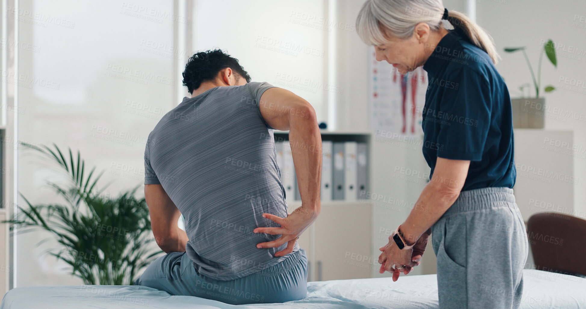 Buy stock photo Back pain, physical therapy and patient at consultation for problem, inflammation or muscle strain. People, chiropractor and treatment for injury, rehabilitation and recovery of spinal ligaments
