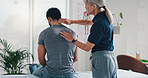 Physiotherapy, back massage and patient man at consultation for spinal problem or inflammation. Person, chiropractor and touch for injury, rehabilitation and recovery of muscle damage clinic bed