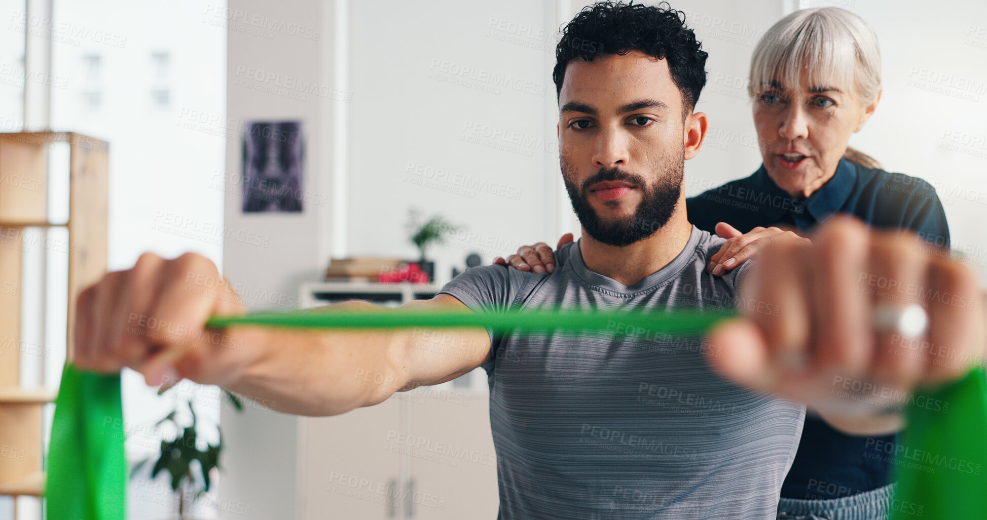 Buy stock photo Physiotherapy, man or hands with resistance band for rehabilitation, muscle exercise or health. Mobility help, shoulder or client stretching with elastic for fitness, physical recovery or balance