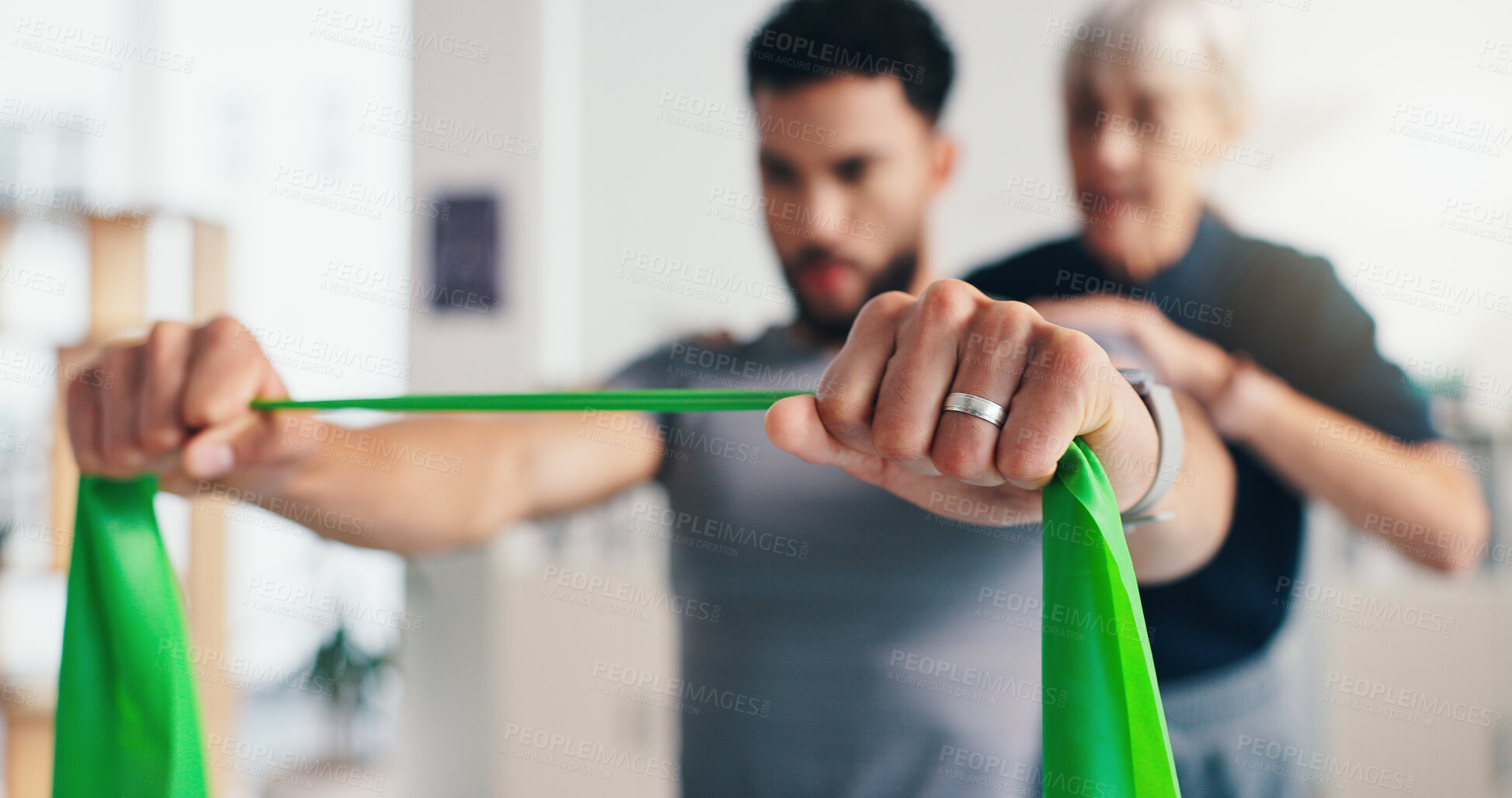 Buy stock photo Physiotherapy, man or hands with resistance band for arms rehabilitation, muscle exercise or body health. Mobility, client or stretching with elastic for fitness balance, physical recovery or help