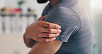 Pain, shoulder and man with hand on arm for problem, inflammation or arthritis disease. Person, closeup and health issue of injury, hurt or risk of weak muscle damage and osteoporosis in body