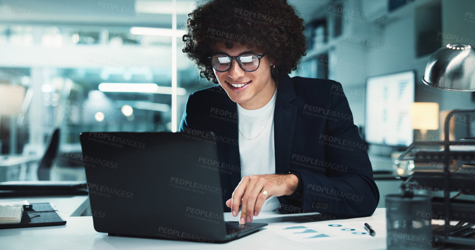 Buy stock photo Night, research and happy man with laptop in office for business, finance management and budget review. Accountant, paperwork and profit report in agency for audit deadline, tax or graphs statistics