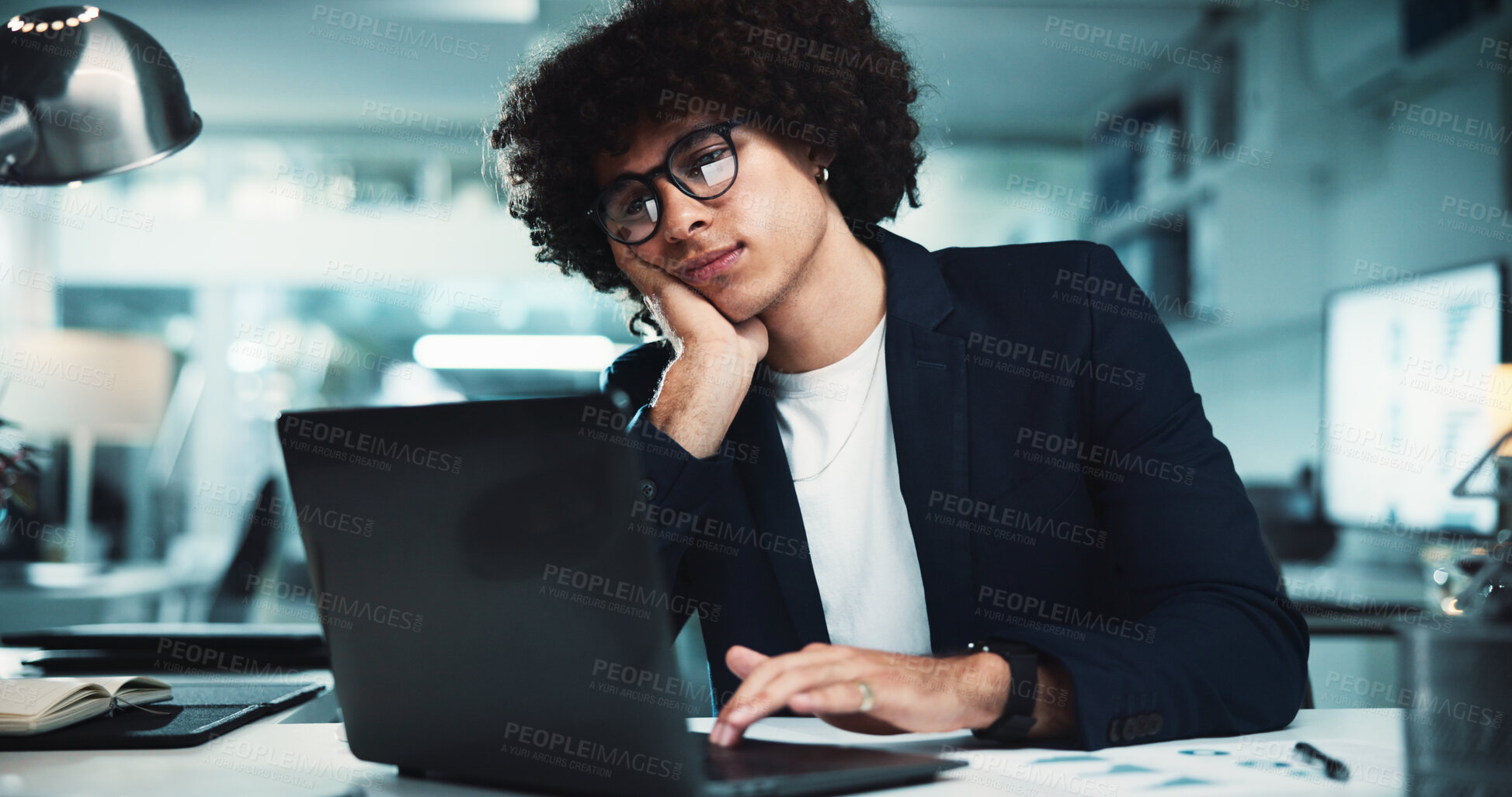 Buy stock photo Bored, laptop and night with business man in office for fatigue, burnout and research deadline. Policy review, email glitch and thinking with person for risk management, tired and brain fog.