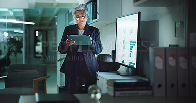 Statistics, tablet and infographic with business woman in office for profit, accounting graph or budget research. Revenue charts, data analysis and sales review with mature person by monitor at night