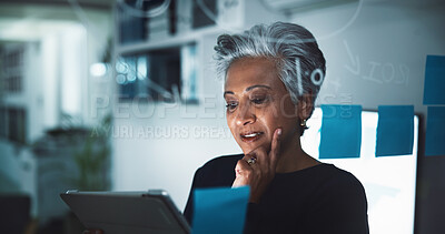 Buy stock photo Mature, business woman or thinking with tablet at night for planning, brainstorming or contemplating decision at office. Female person, CEO or employee working late with technology for corporate idea
