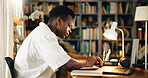 Laptop, college and notebook with black man in home office for research, online course and scholarship. Writing, university student and elearning webinar with person and notes for report and project