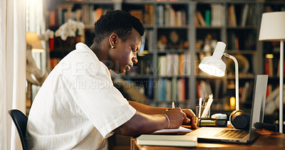 Buy stock photo Laptop, college and notebook with black man in home office for research, online course and scholarship. Writing, university student and elearning webinar with person and notes for report and project