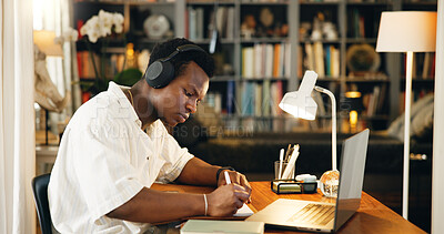 Buy stock photo Laptop, college and headphones with black man writing for research, online course and scholarship. Notebook, university student and elearning webinar with person in home office for report and project