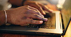 Hands, laptop and typing in home for education, studying and e learning with online course at apartment. Person, student and computer with keyboard for scholarship, project or assessment at house