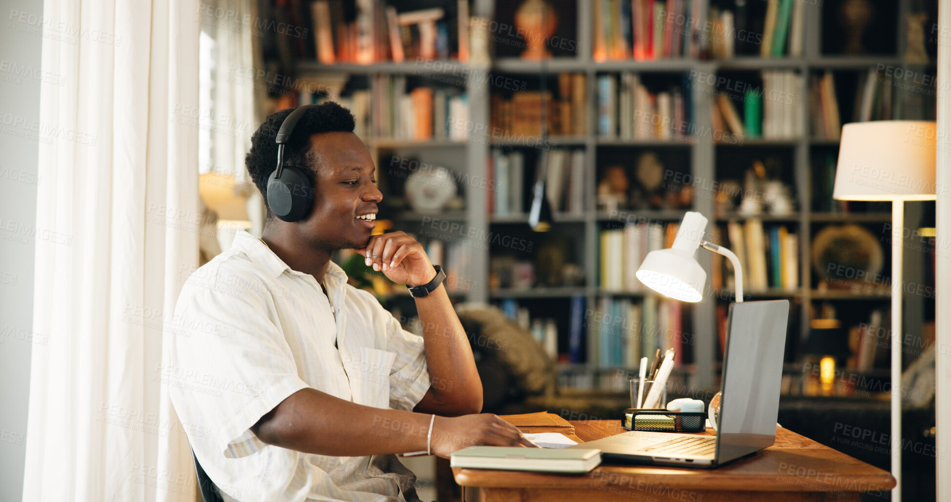 Buy stock photo Black man, headphones and elearning on laptop, home and happy for virtual class, development and info on webinar. Person, computer and student with education, video call or online course at apartment