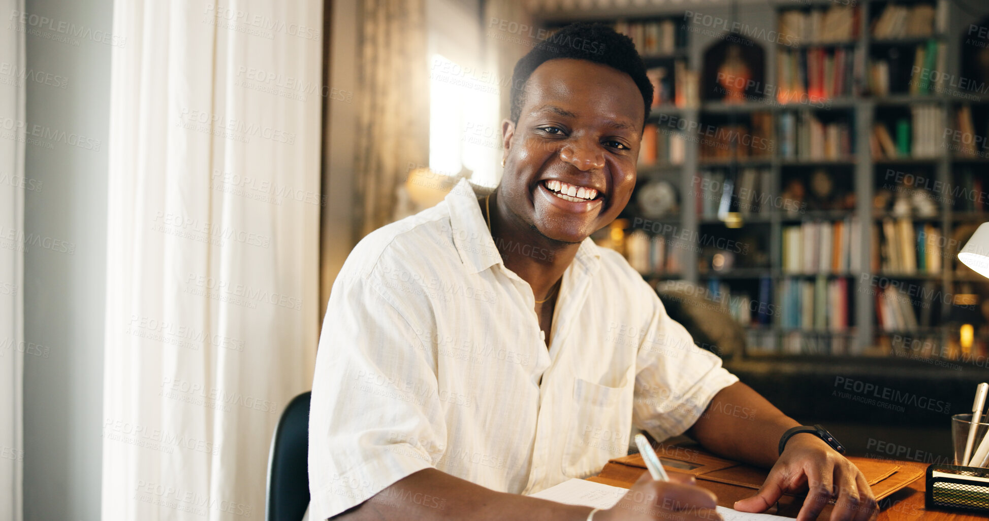 Buy stock photo Black man, student and writing with portrait, home or happy for distance learning, development or progress. Person, notes and books with pride, education or scholarship for college project in Nigeria