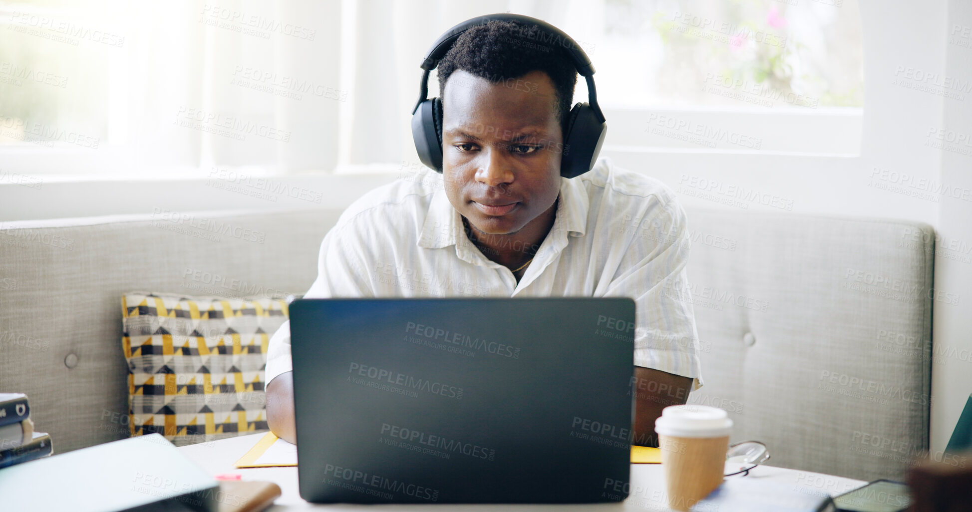 Buy stock photo Black man, student and headphones with laptop, home or reading with e learning, scholarship or online course. Person, notes and books with video, education or listening for college project in house